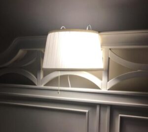 bed reading lamp installed in headboard